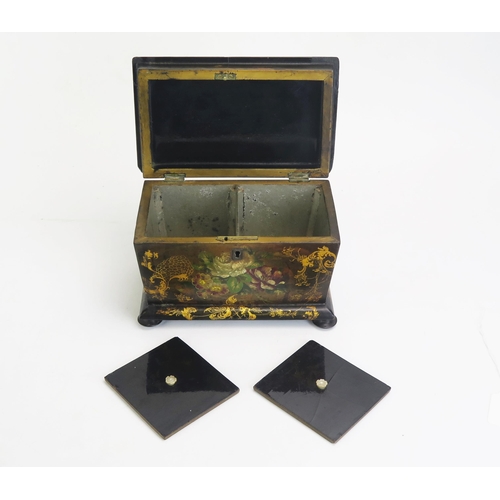 1300 - A 19th century papier mache tea caddy, of rectangular outline, the hinged lid enclosing two lidded z... 