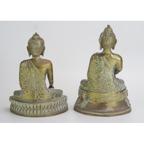 1639 - A pair of 20th century brass Buddha's seated cross legged on a lotus flower, 21cm high.