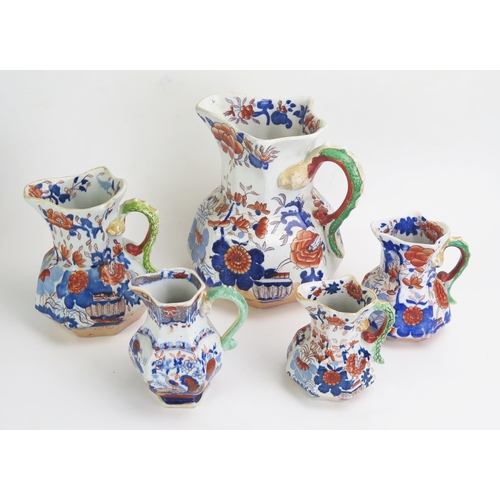 1653 - Five assorted Mason's Ironstone china graduated jugs with blue Mason's marks.