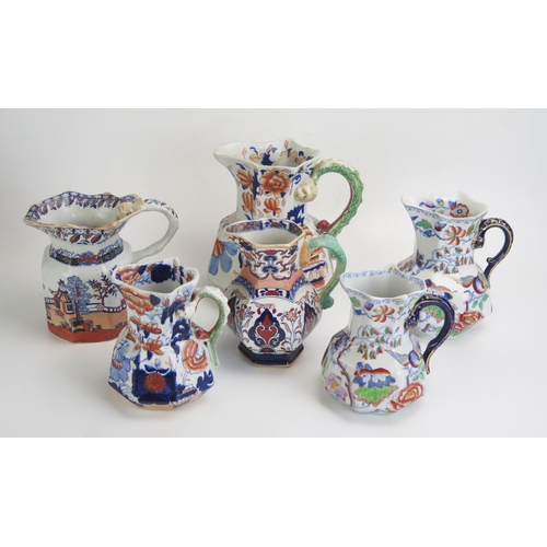 1655 - Six assorted Ironstone china jugs, various sizes. (6).