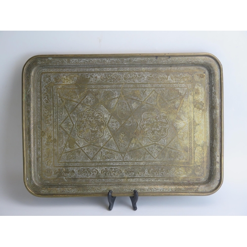 1688 - A Middle Eastern rectangular brass tray decorated with animals  and banded floral decoration, 53cm w... 