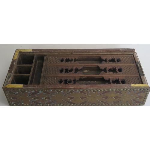 1690 - An Indo-Persian hardwood and copper bound rectangular box, the sliding lid enclosing a fitted interi... 