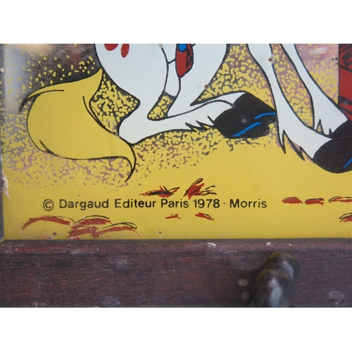 1691 - A Lucky Luke mirror, based on the TV cartoon series. 17 x 23.5cm. F & G.