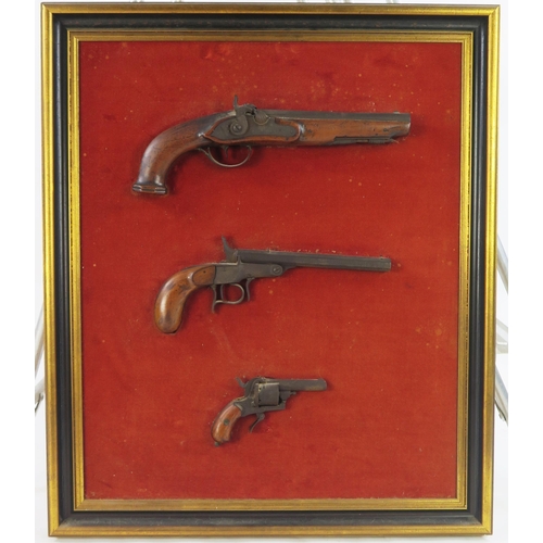 1777 - Three assorted 19th century and later pistols, mounted and framed. WE DO NOT POST THESE ITEMS IN HOU... 