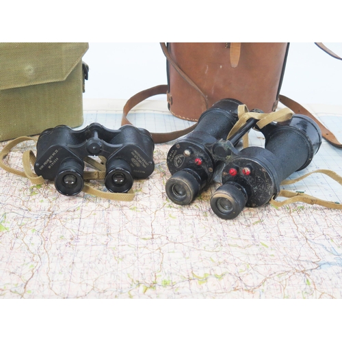 1781 - A pair of No 2 MkIII field glasses contained in a canvas case, a linen backed map of Torquay and a p... 