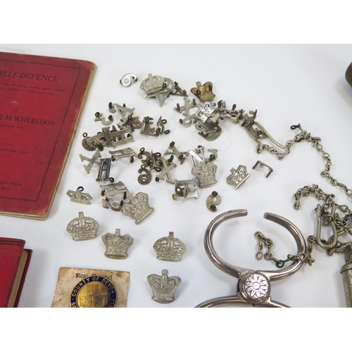 1787 - Two pairs of polished steel handcuffs, Metropolitan whistles, Devon Constabulary buttons, badges, bo... 