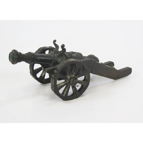 1789 - A bronze model of a cannon with 13cm barrel, the carriage mounted on spoke wheels. overall length 26... 