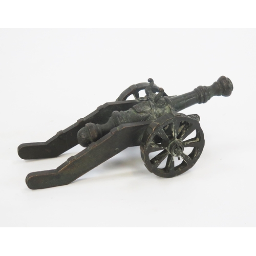 1789 - A bronze model of a cannon with 13cm barrel, the carriage mounted on spoke wheels. overall length 26... 