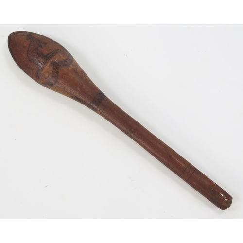 1825 - An Aboriginal club, the oval head decorated with a kangaroo and an emu, on slender shaft 60cm long.