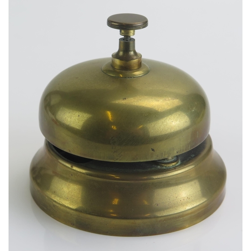 1841 - An all brass call bell of circular form, 10cm diameter.