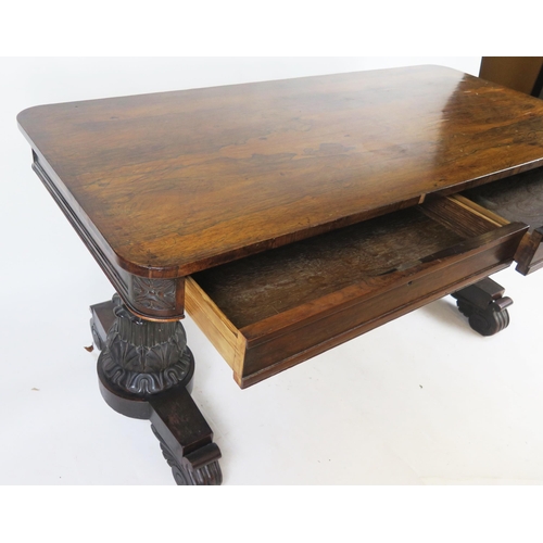 801 - A George IV Gillows Style Rosewood Library Table with two frieze drawers and raised on twin tapering... 