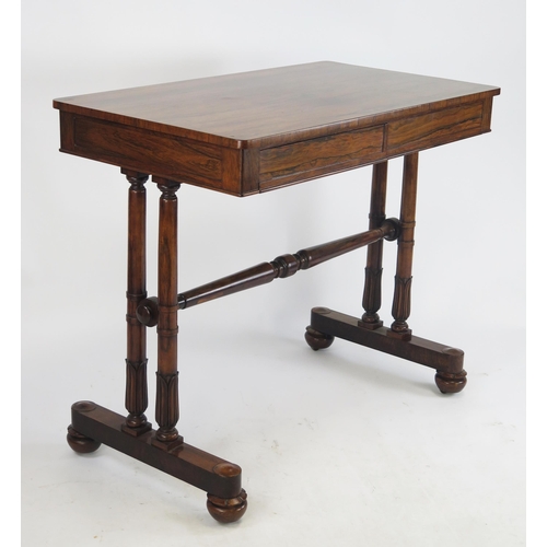 807 - An Early Victorian Rosewood Table with two frieze drawers raised on four tapering columns with carve... 