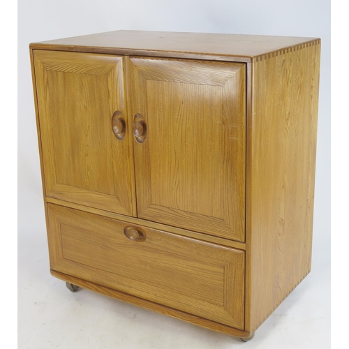 839 - An Ercol Elm Cabinet, 85(w)x95(h)x52(d)cm