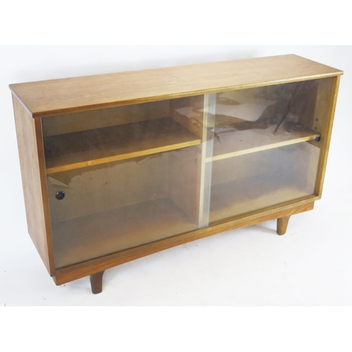 848 - A Teak Glazed Bookcase, 122(w)x74(h)x31(d)cm