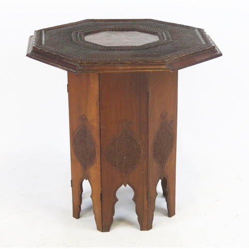 866 - A Carved Indian Folding Table