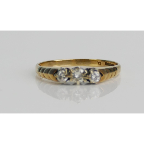 103 - A 9ct Gold and Diamond Three Stone Ring, size M, hallmarked, 1.53g