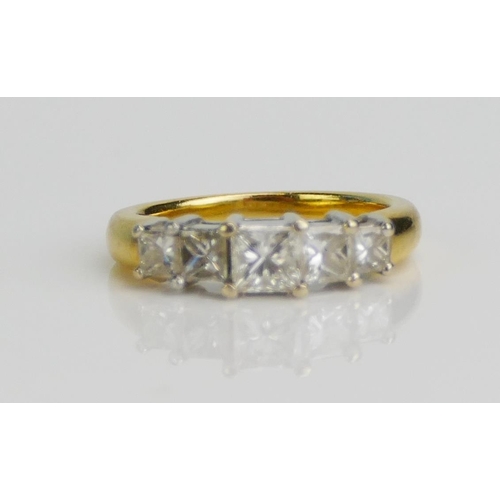 111 - An 18K Gold and Princess Cut Diamond Five Stone Ring, size N.75, stamped 18K 750, 6.85g. Sold with C... 