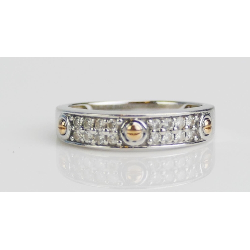 113 - An 18ct White and Yellow Gold and Diamond Two Row Half Eternity Ring with faux screw decoration, siz... 