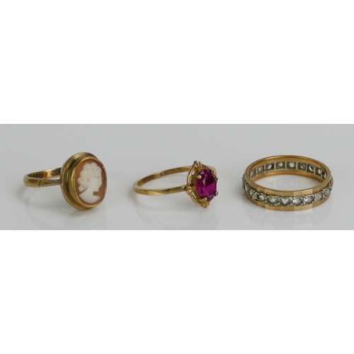 124 - Three 9ct Gold Gem Set Rings including an a CZ eternity (size  N, stamped 9CT, 2.29g), synthetic rub... 