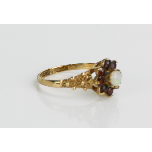 129 - A 9ct Gold, Garnet and Opal Cluster Ring, size L.5, Birmingham marks, 1.89g