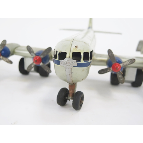 1352 - Gama PAA Strato Clipper Tinplate Battery Operated Airplane in white and silver with blue and red acc... 