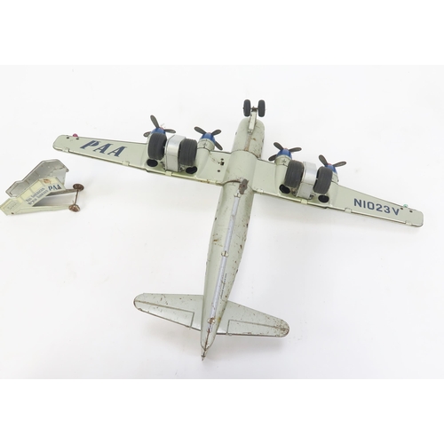 1352 - Gama PAA Strato Clipper Tinplate Battery Operated Airplane in white and silver with blue and red acc... 