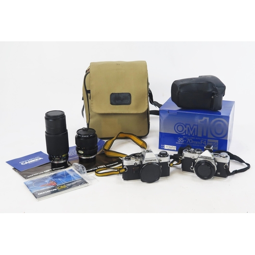 1404 - Olympus Camera Pair Including OM1N and OM10 (boxed) bodys with S Zuiko 35-70mm f/4 and Hoya HMC 80-2... 