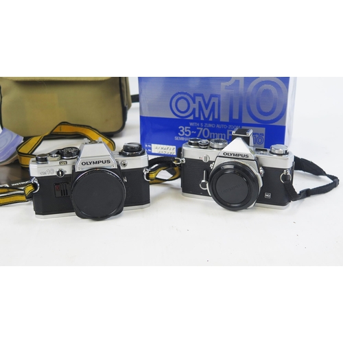 1404 - Olympus Camera Pair Including OM1N and OM10 (boxed) bodys with S Zuiko 35-70mm f/4 and Hoya HMC 80-2... 