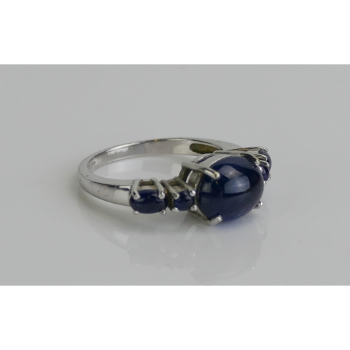 143 - A 9ct Gold and Star Sapphire Cabochon Gem Set Ring, size M.75, Birmingham marks, 4.6g