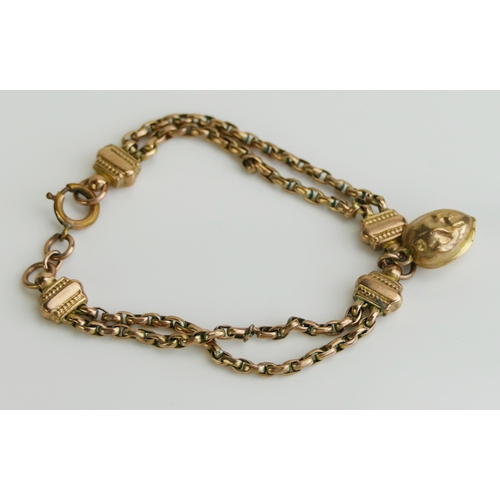 155 - A Victorian and later 9ct Gold Bracelet with walnut charm, 16.5cm, stamped 9CT, 7.28g