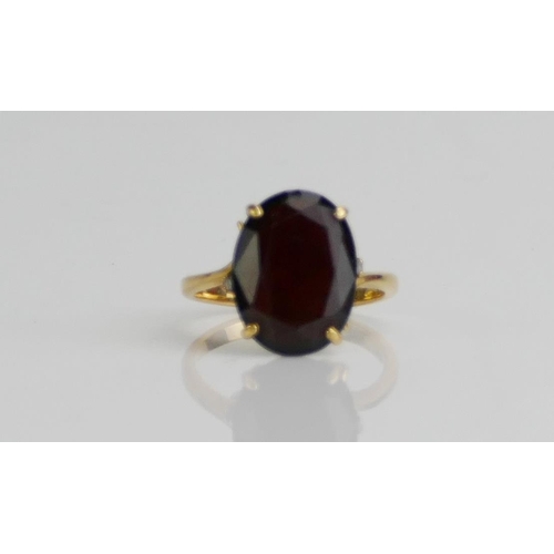 166 - An 18K Gold and Garnet Ring, 15.4x11.5mm stone, size O.5, stamped 18K 750, 5.29g