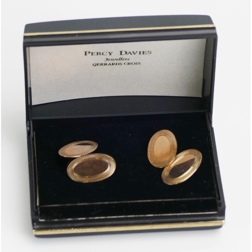 17 - A Pair of 9ct Gold Cufflinks with engine turned decoration, hallmarked, 4.49g. Boxed