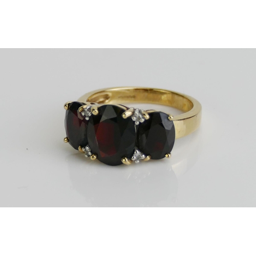 172 - A 9ct Gold, Garnet and Diamond Ring, 10x7.9mm principal stone, size M.5, hallmarked, 4.21g