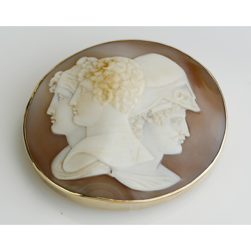 174 - A Large Sardonyx Triple Head Cameo Brooch in a precious yellow metal surround with safety chain, 54.... 