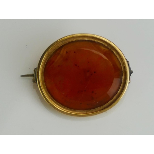 230 - A 19th Century Precious Yellow Metal and Agate Brooch with initial engraved to the reverse of the st... 