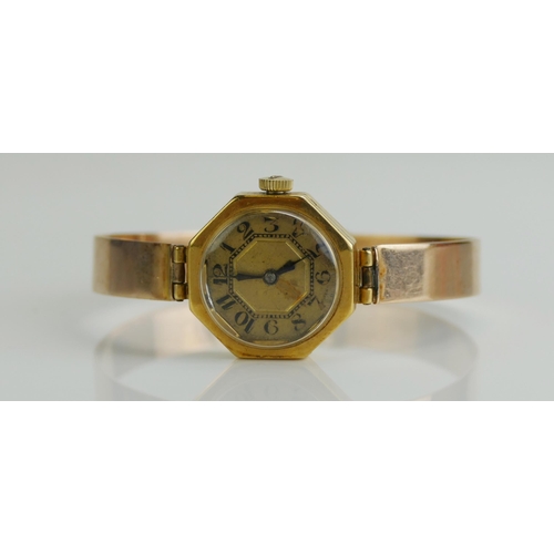 273 - An 18ct Gold Lady's Wristwatch on a yellow metal strap, KEE tests as 9ct, 19.42g gross.  UNLESS OTHE... 