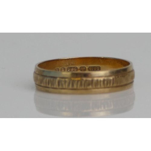 28 - A 9ct Gold Wedding Band with engraved decoration, 4.7mm wide, size R.25, hallmarked, 2.52g