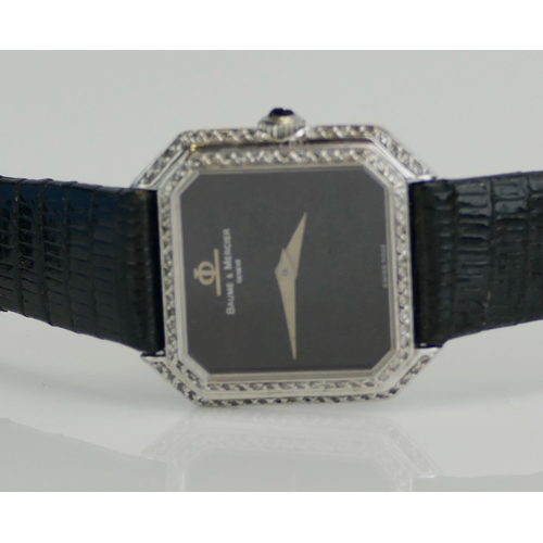 3 - A Baume & Mercier 18K White Gold and Diamond Lady's Wristwatch, the 23.3x20.4mm case with a black di... 