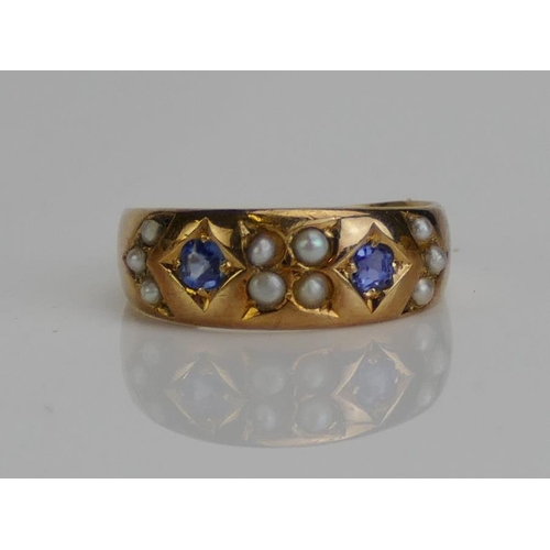 49 - An Antique 15ct Gold, Sapphire and Seed Pearl Ring, size J.75, Birmingham hallmarks (date letter obs... 