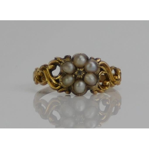 51 - A Victorian Pearl or Cultured Pearl and Rose Cut Diamond Ring with scrolling pierced shoulders and i... 