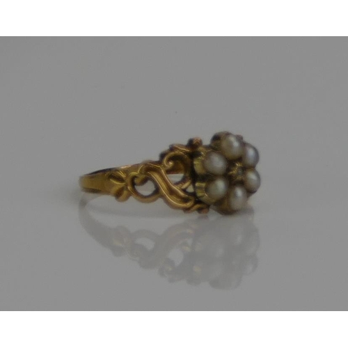 51 - A Victorian Pearl or Cultured Pearl and Rose Cut Diamond Ring with scrolling pierced shoulders and i... 