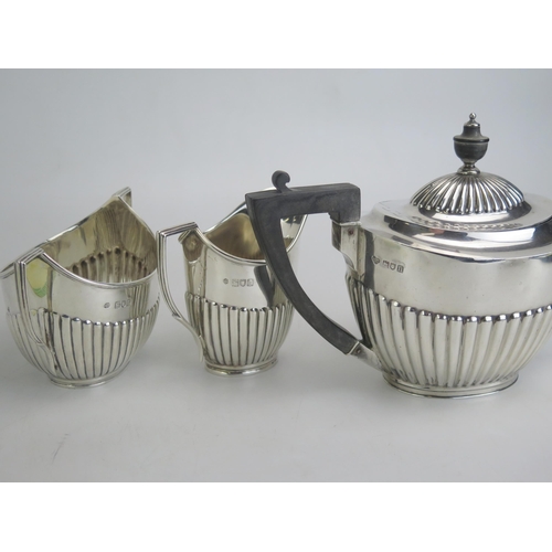 511 - An Edward VII silver teapot, maker Goldsmith & Silversmiths Co Ltd, London 1908, with half reeded de... 