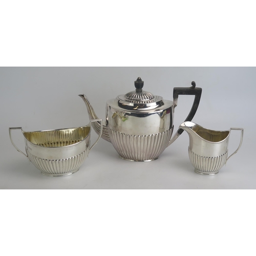 513 - A matched silver three-piece tea service, various makers and dates, with half reeded decoration, 995... 