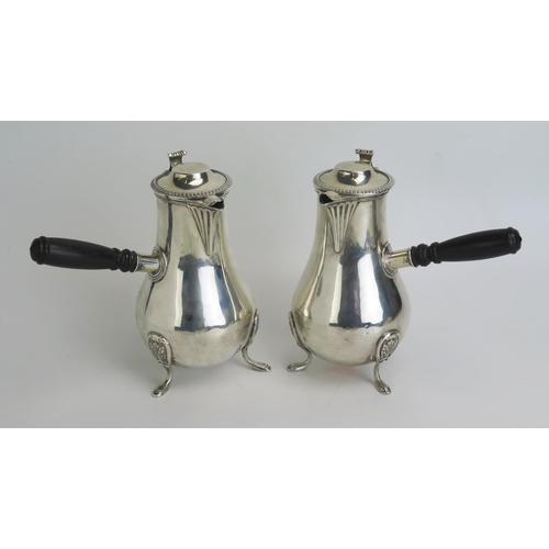 525 - A pair of late Victorian silver chocolate maker William Hutton & Sons, London, 1890, of baluster for... 