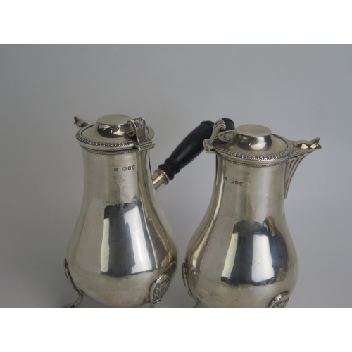 525 - A pair of late Victorian silver chocolate maker William Hutton & Sons, London, 1890, of baluster for... 