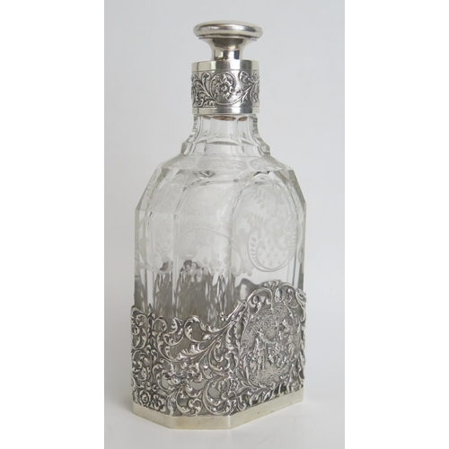 530 - A continental etched glass and silver mounted decanter and stopper, bears import marks, the mount de... 