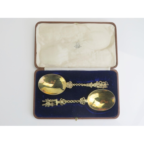 534 - A pair of George V silver gilt spoons,  maker Pairpoint Brothers, London, 1920, the oval bowls on tw... 