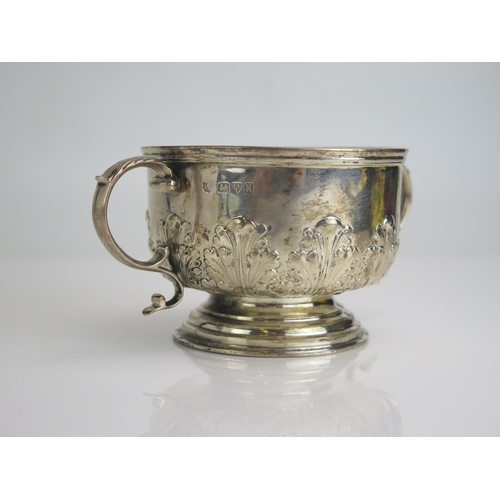 535 - A George V silver twin handled bowl, maker S Blanckensee & Son Ltd, Chester, 1935, with floral repou... 