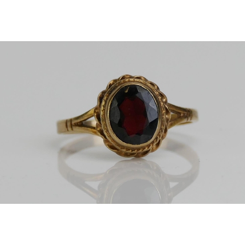 55 - A 9ct Gold and Garnet Dress Ring, c. 13.7x6.9mm principal stone, size S.25, hallmarked, 3.35g