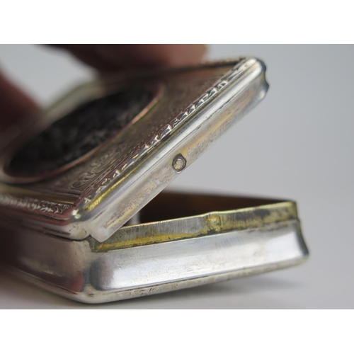 555 - An early 19th century French parcel gilt and silver  snuff box, stamped marks, of rectangular form, ... 